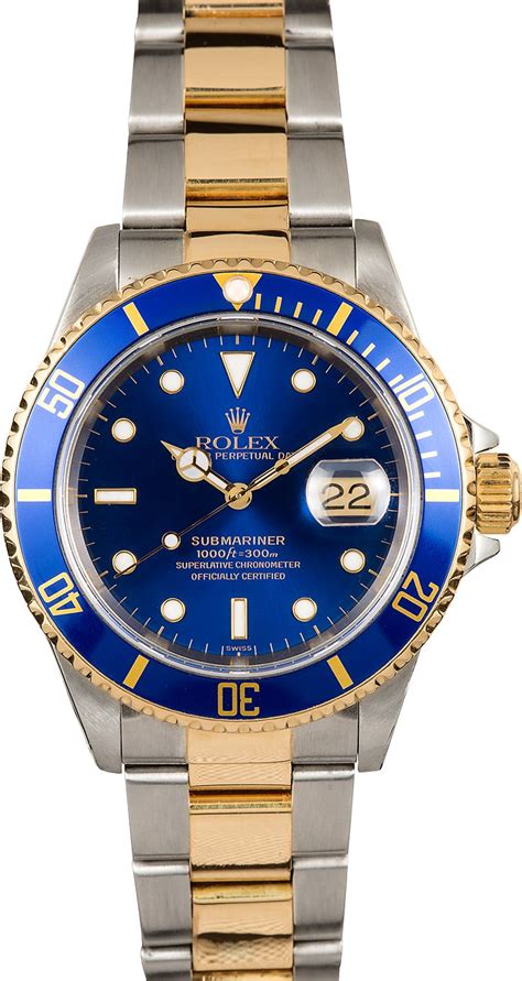 rolex watch with blue face.